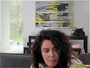Spanish teen hotty rides her man while his mom watches TV
